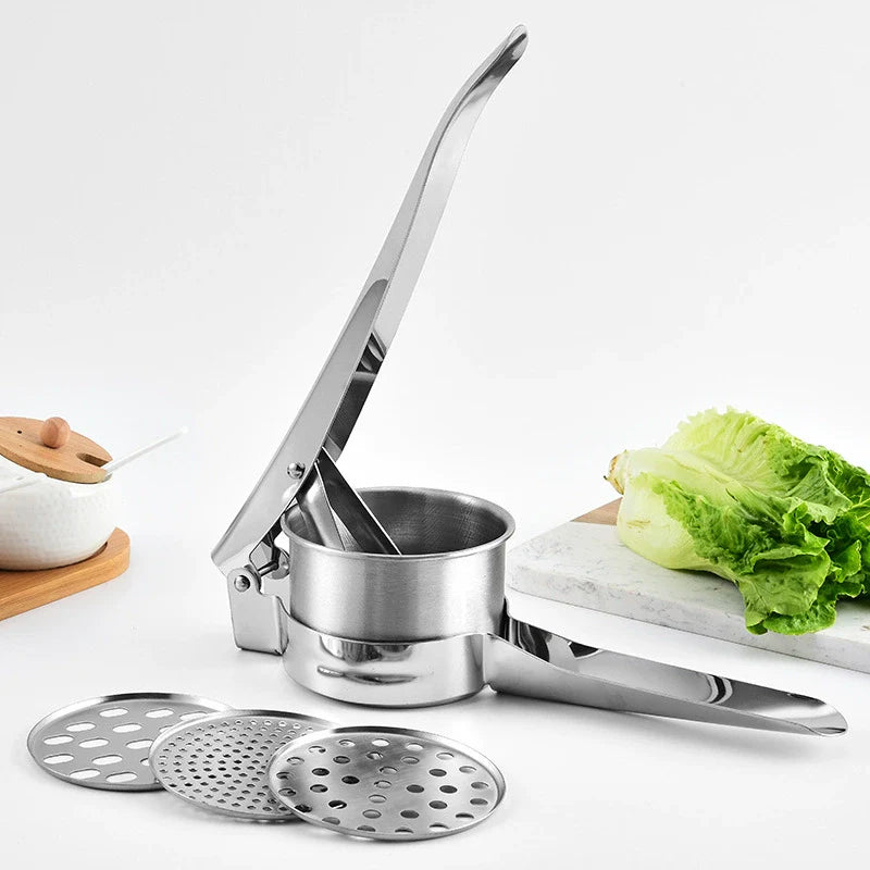 Stainless steel hand juicer with three different mesh discs on a white background