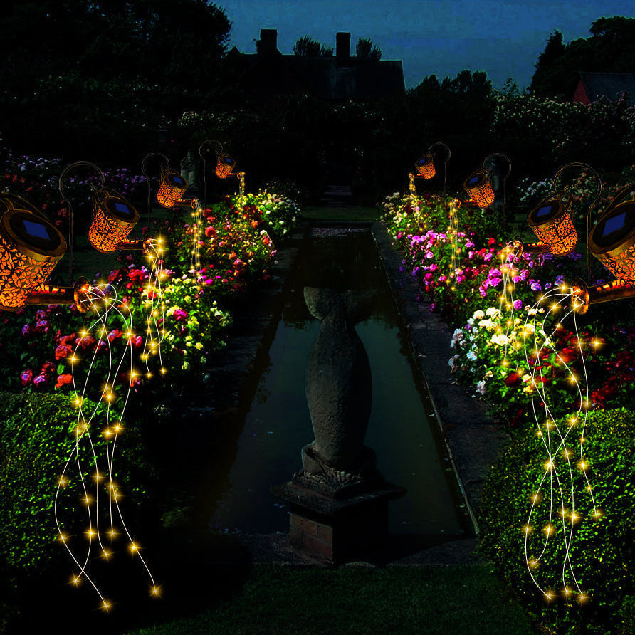 Garden pathway with decorative lights and flowers at night