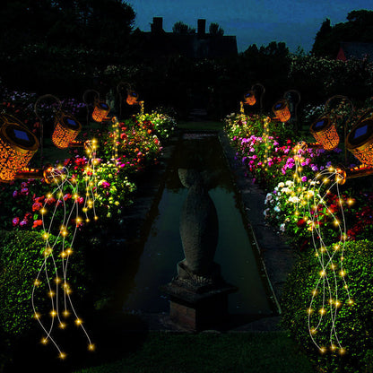 Garden pathway with decorative lights and flowers at night