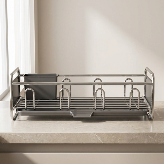 Stainless steel dish rack on a kitchen counter with a neutral background