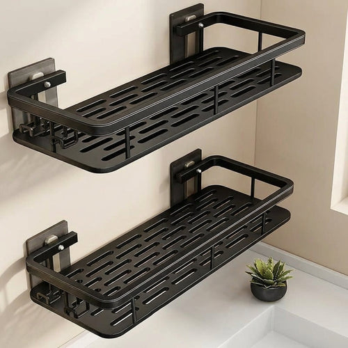 Two black wall-mounted shelves in a bathroom setting with a small plant.