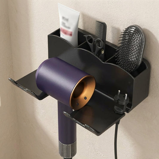 Wall-mounted hair care station with a purple hair dryer, brush, and other tools on a beige wall.